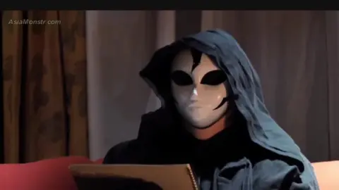 Asian Performers in Costumes Engage in Intimate Scenes