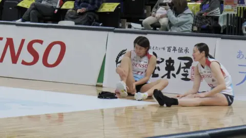 Asian Sportswomen in Uniform