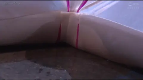 Asian Women in Costumes Industrial Setting