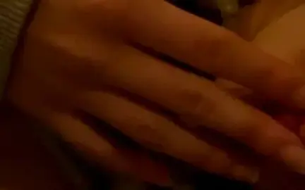 Slim Caucasian Woman Masturbates in Dim Bedroom