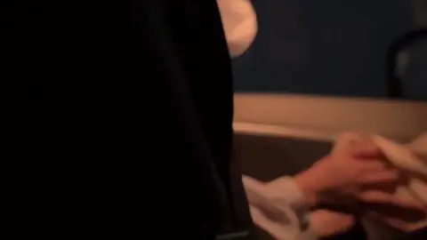 Masked Couple in Car Intimacy