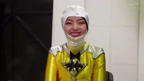 Asian Superheroine in Yellow and White Costume