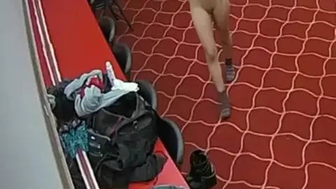 changes clothes and sprays perfume