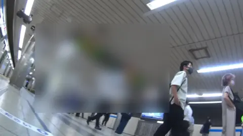 Asian Girl in Short Skirt on Subway Train