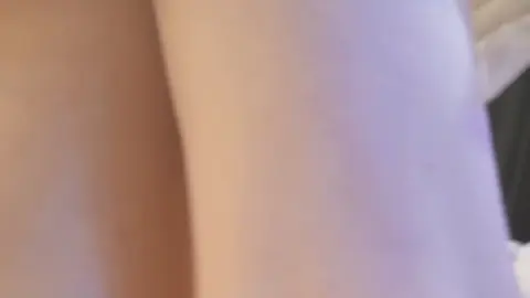 Asian Performer in White Ruffled Skirt on Stage