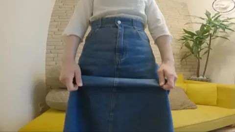 Asian Teen Undresses on Yellow Couch