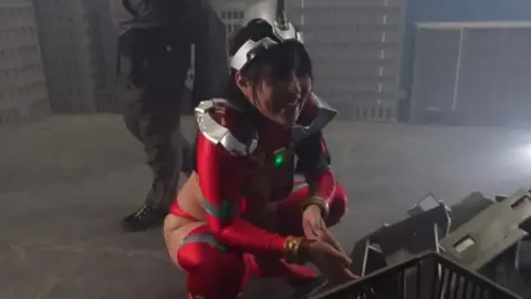 Asian Women in Sailor Outfits and Red Costumes