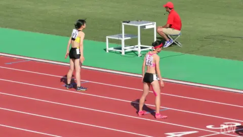 Asian Athletes in Sports Bra and Shorts on Track