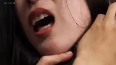 Asian Wrestlers Grapple in Ring