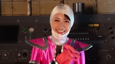 Asian Cosplay Girls Interact in Futuristic Setting