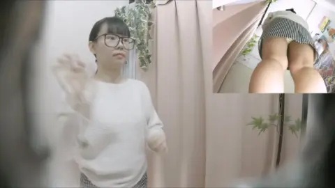 Asian Girl Prepares in Dressing Room