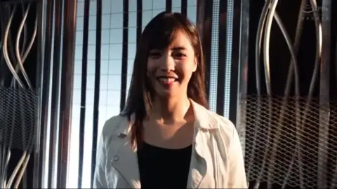 Asian Women in Bodysuits Engage in Erotic Scenes